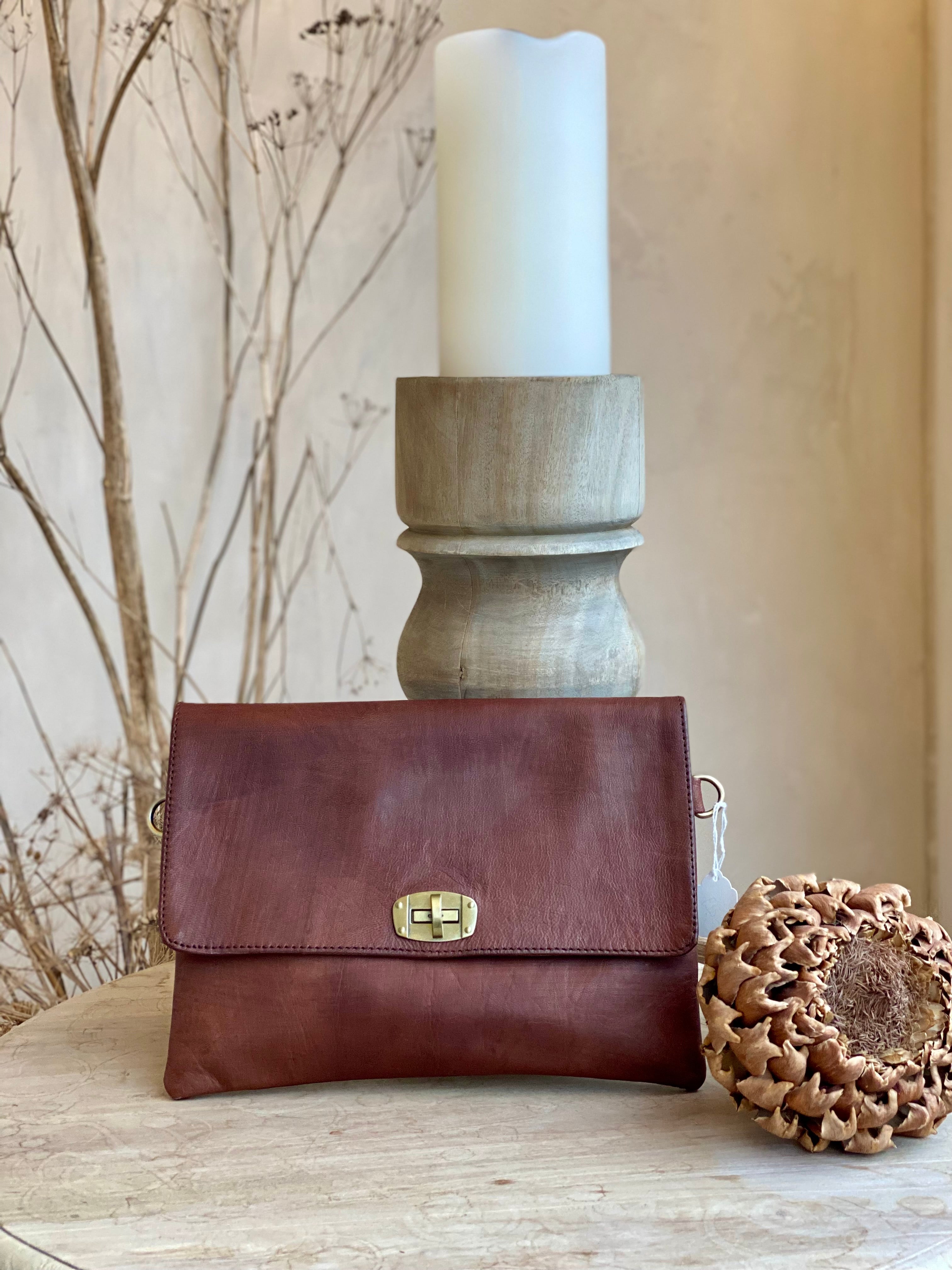 Leather clutch with a detachable strap